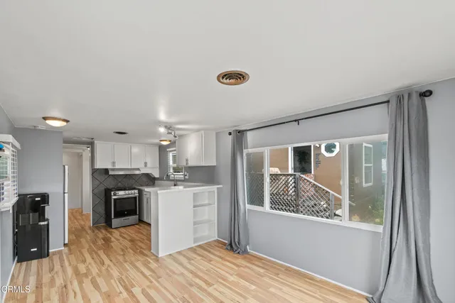 a view of a kitchen with a window