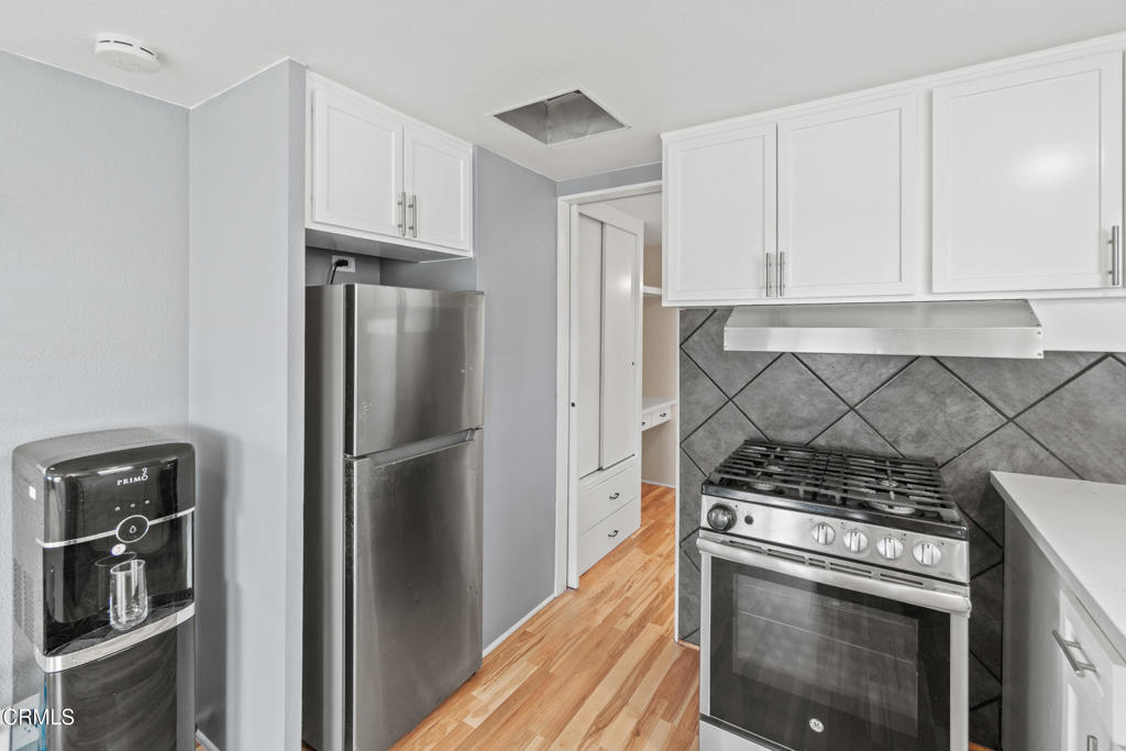 7368 Hollister Avenue, Unit 28 Goleta, CA 93117 - Photo 17 of 33 a kitchen with a stove top oven and refrigerator