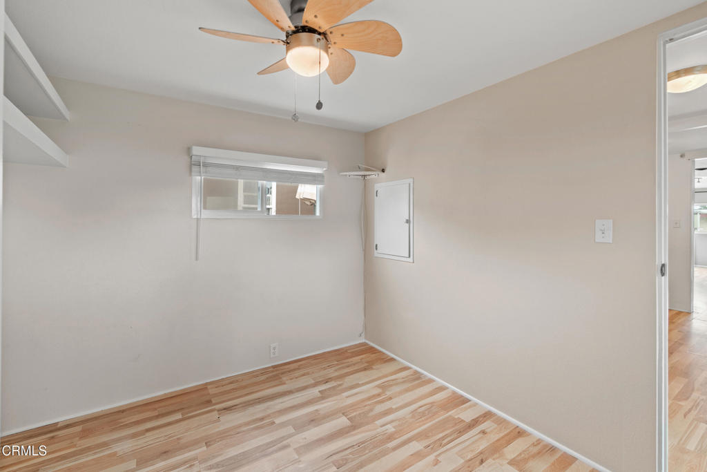 7368 Hollister Avenue, Unit 28 Goleta, CA 93117 - Photo 24 of 33 a view of a room with wooden floor and a ceiling fan