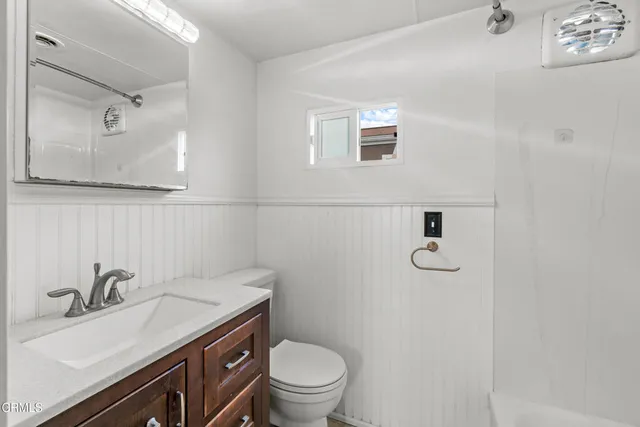 a bathroom with a sink toilet and a tub
