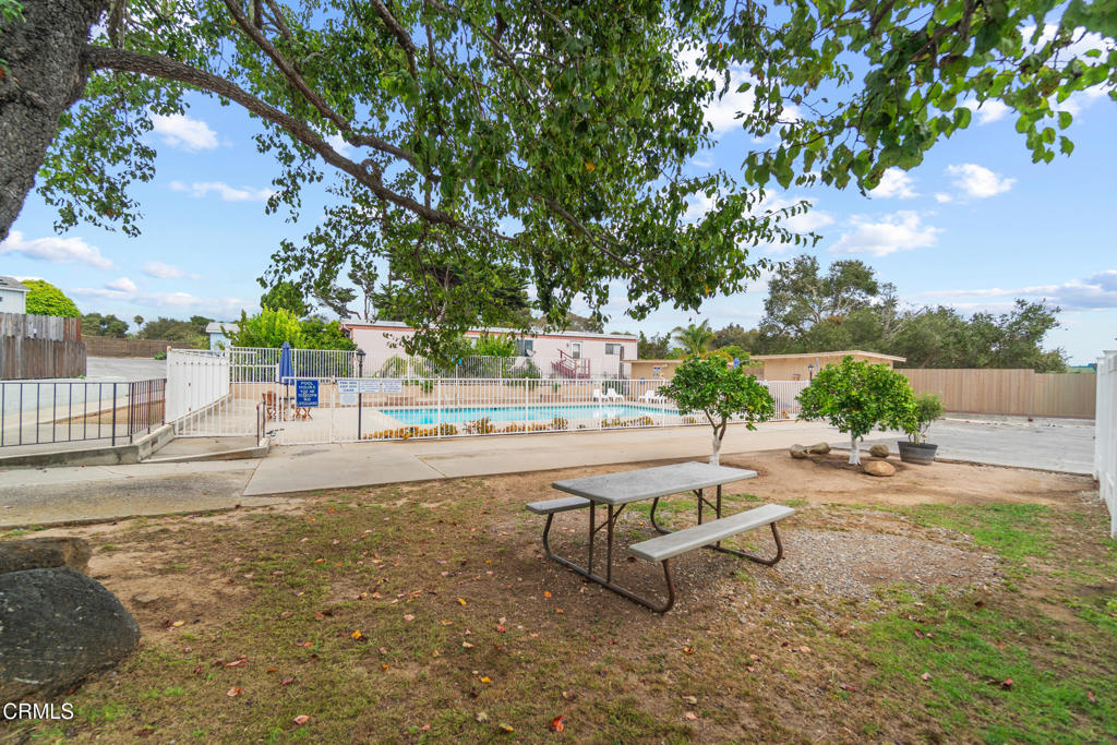 7368 Hollister Avenue, Unit 28 Goleta, CA 93117 - Photo 31 of 33 a swimming pool with outdoor seating and yard
