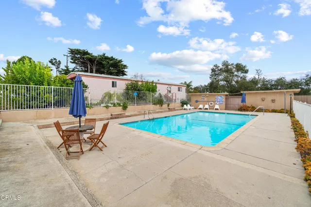 a view of a swimming pool with a lounge chair