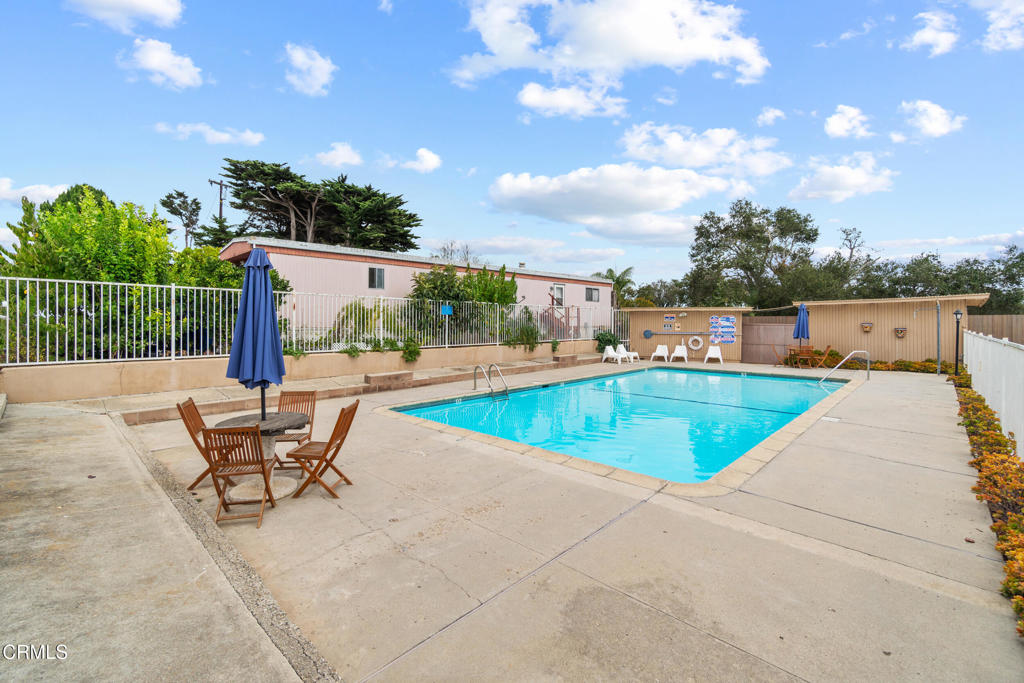 7368 Hollister Avenue, Unit 28 Goleta, CA 93117 - Photo 32 of 33 a view of a swimming pool with a lounge chair