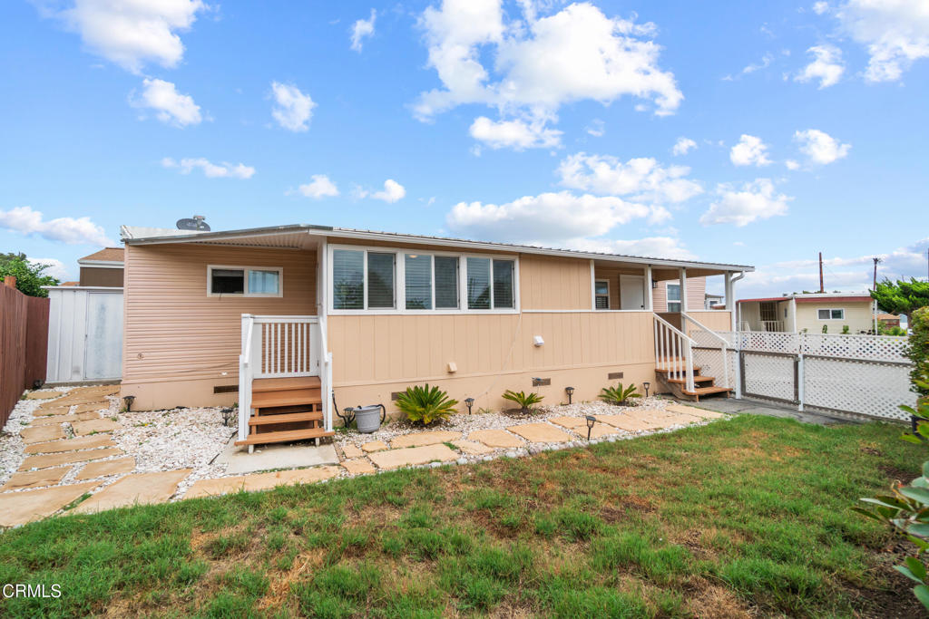 7368 Hollister Avenue, Unit 28 Goleta, CA 93117 - Photo 4 of 33 a front view of a house with a yard