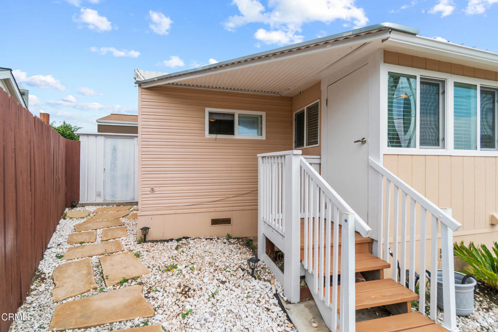 7368 Hollister Avenue, Unit 28 Goleta, CA 93117 - Photo 5 of 33 a view of a house with wooden floor and fence