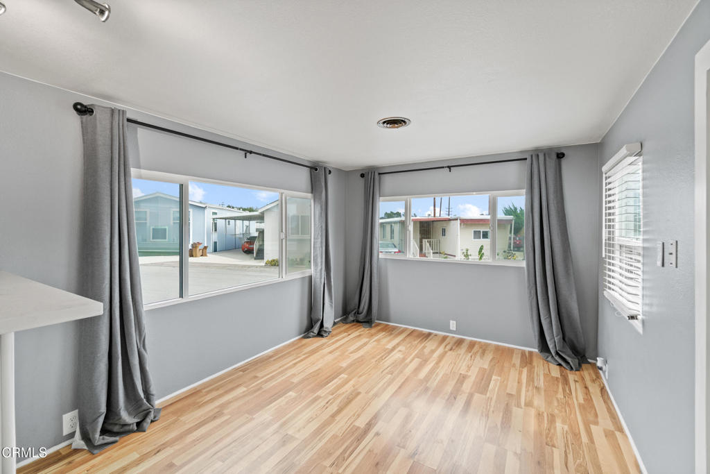 7368 Hollister Avenue, Unit 28 Goleta, CA 93117 - Photo 10 of 33 a bedroom with a bed and glass door