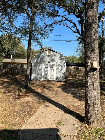 a view of a backyard of the house
