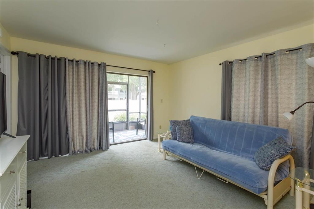 240 Orienta Point Street, Unit 240 Altamonte Springs, FL 32701 - Photo 3 of 20 a living room with furniture and a window