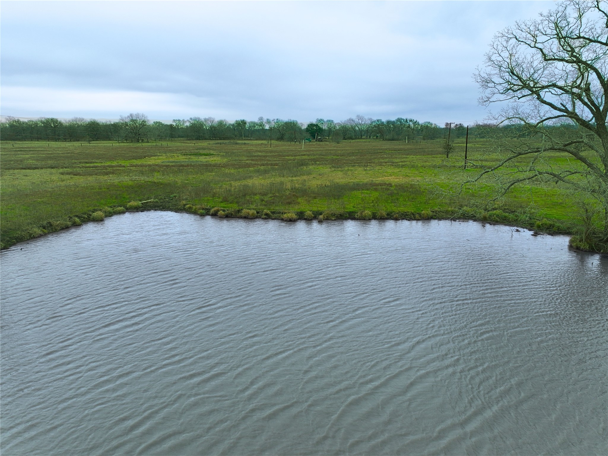 a view of a lake with a big yard