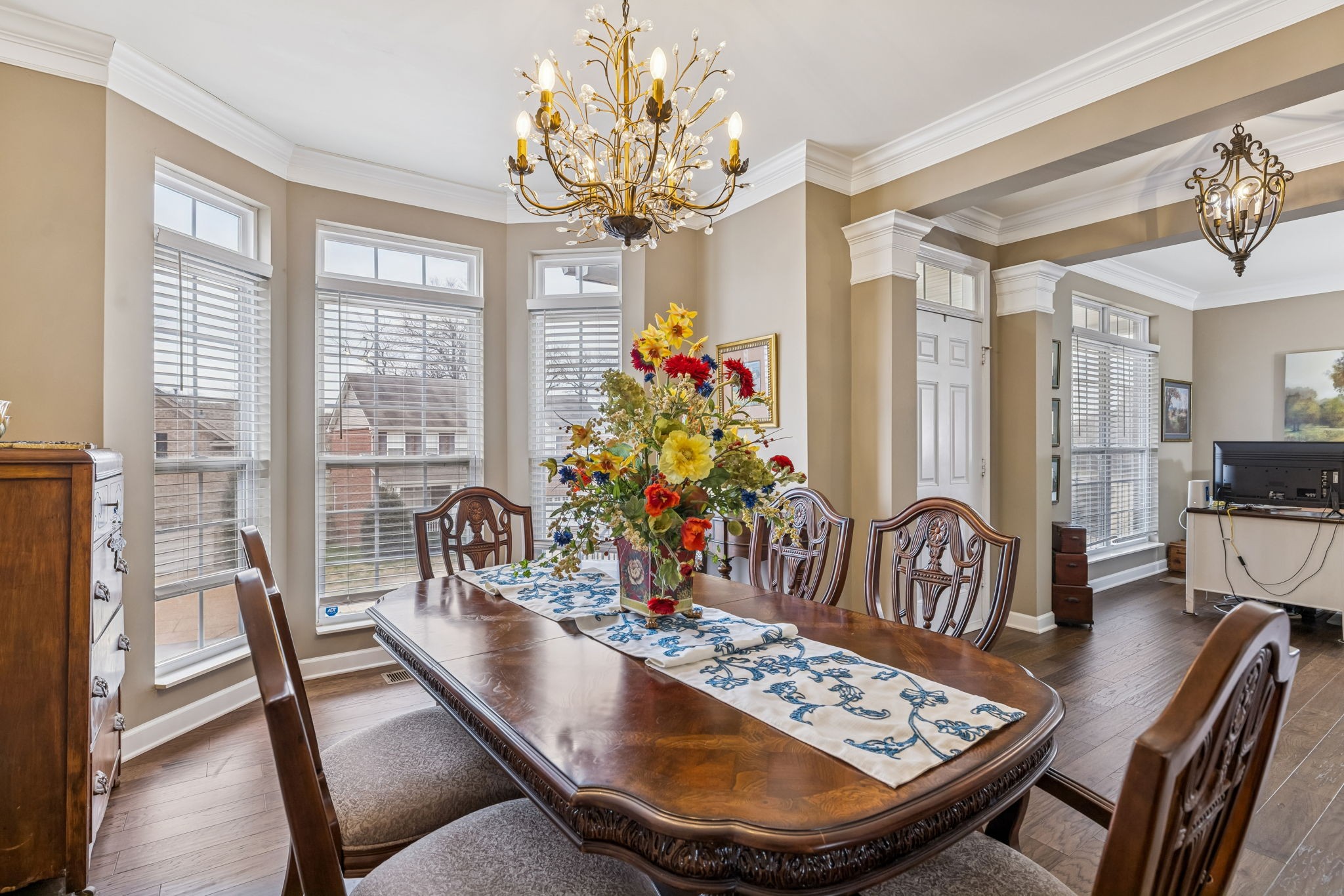 4028 Williford Way Spring Hill, TN 37174 - Photo 16 of 70 a view of a dining room with furniture a chandelier and wooden floor