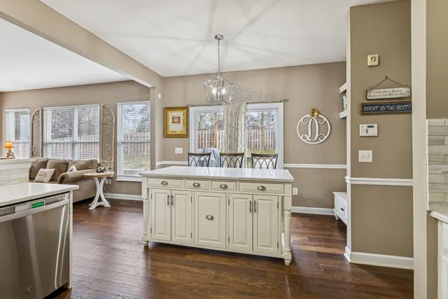 a bedroom with a large bed and a ceiling fan