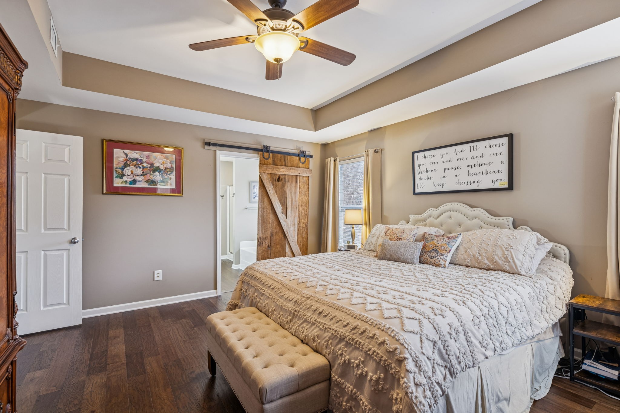 4028 Williford Way Spring Hill, TN 37174 - Photo 46 of 70 a bedroom with a large bed and a ceiling fan