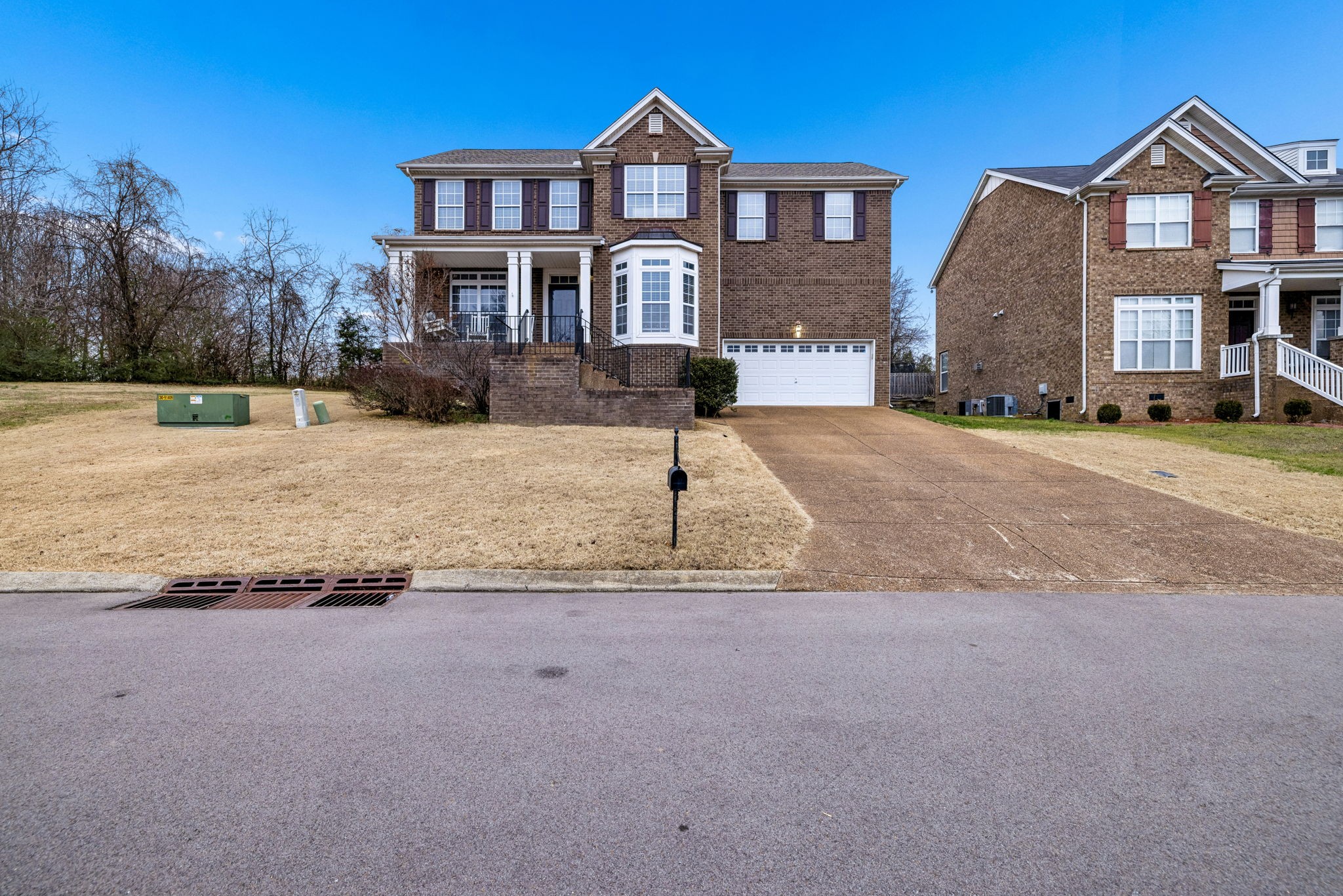 4028 Williford Way Spring Hill, TN 37174 - Photo 6 of 70 a front view of a house with a yard and garage