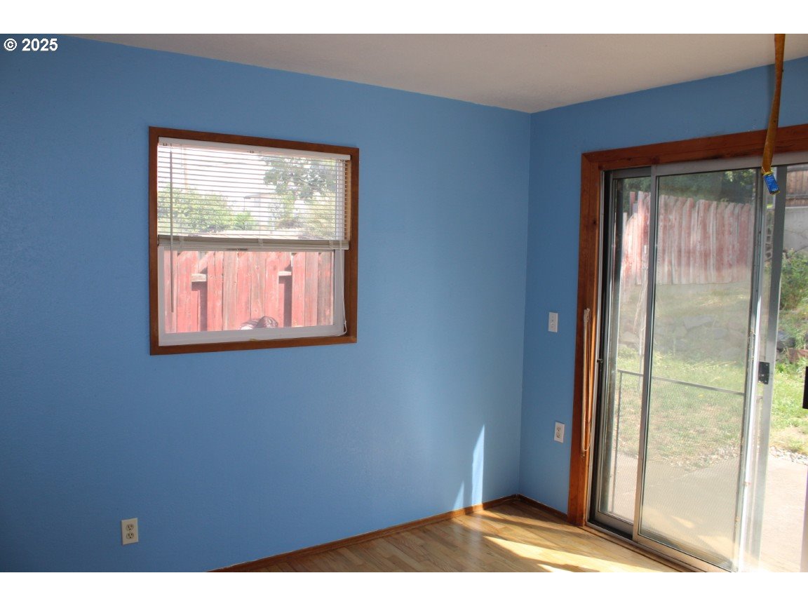 1206 Southwest 24th Street Pendleton, OR 97801 - Photo 16 of 21 a view of an empty room with wooden floor and a window