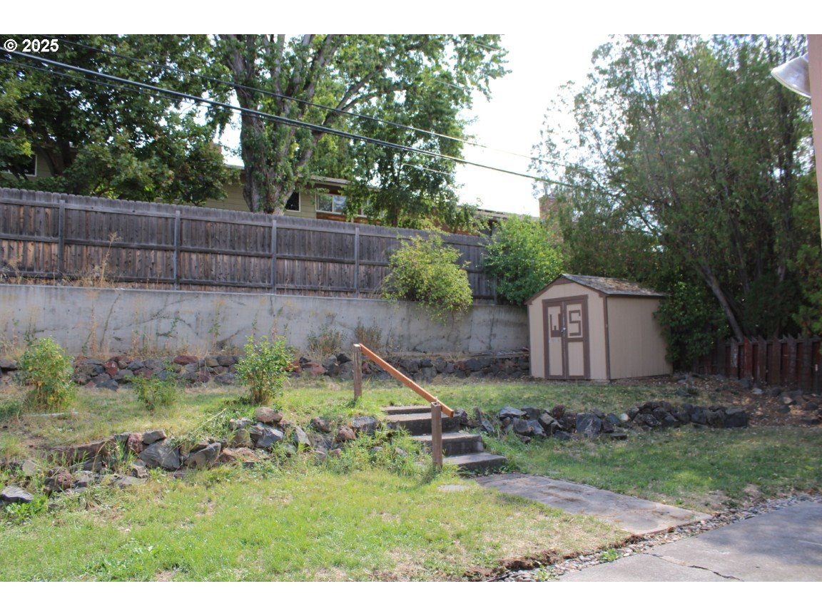 1206 Southwest 24th Street Pendleton, OR 97801 - Photo 20 of 21 a backyard of a house with a swing and plants