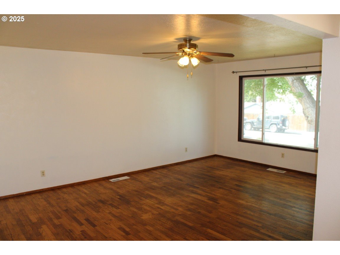 1206 Southwest 24th Street Pendleton, OR 97801 - Photo 4 of 21 a view of an empty room with a window