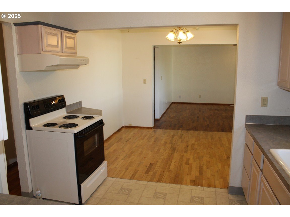 1206 Southwest 24th Street Pendleton, OR 97801 - Photo 8 of 21 a kitchen view with wooden cabinets