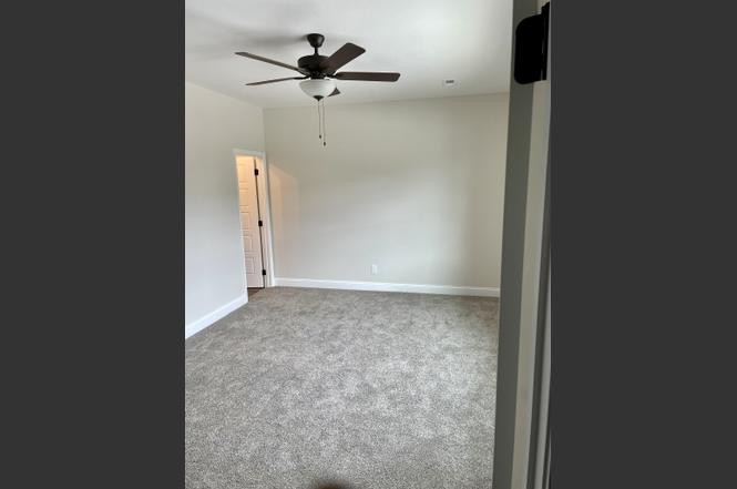 500 Peachers Mill Road, Unit C2 Clarksville, TN 37042 - Photo 12 of 16 an empty room with a ceiling fan and a window