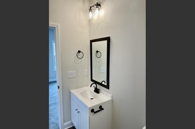 500 Peachers Mill Road, Unit C2 Clarksville, TN 37042 - Photo 13 of 16 a bathroom with a sink a mirror and shower