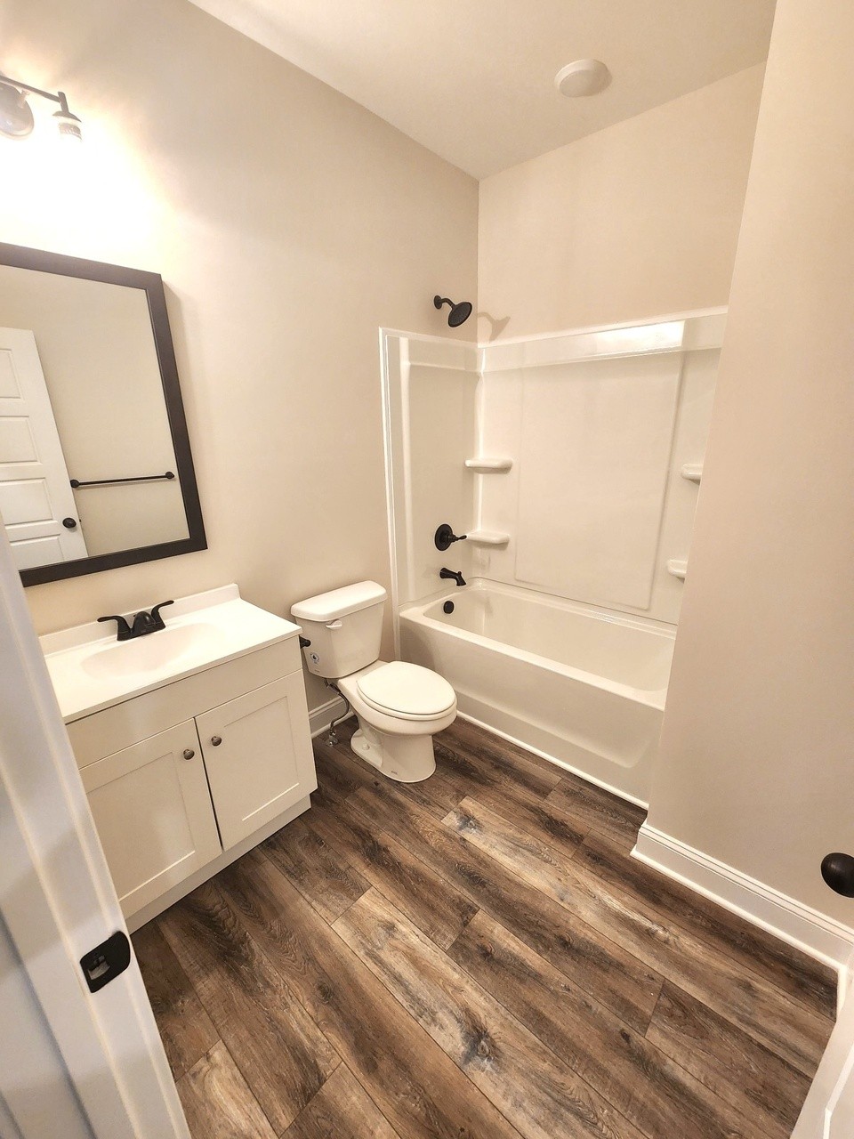 500 Peachers Mill Road, Unit C2 Clarksville, TN 37042 - Photo 15 of 16 a bathroom with a sink a toilet and a mirror