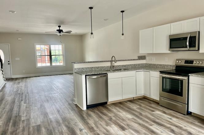 500 Peachers Mill Road, Unit C2 Clarksville, TN 37042 - Photo 5 of 16 a kitchen with a sink stove and microwave