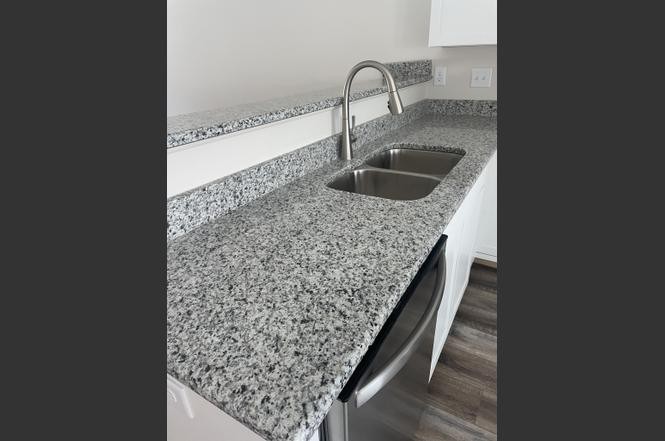 500 Peachers Mill Road, Unit C2 Clarksville, TN 37042 - Photo 7 of 16 a bathroom with a granite countertop sink
