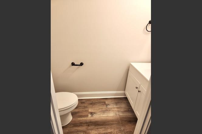 500 Peachers Mill Road, Unit C2 Clarksville, TN 37042 - Photo 8 of 16 a bathroom with a granite countertop toilet and a sink