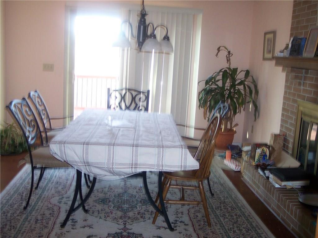 206 Ridgeview Drive Wexford, PA 15090 - Photo 3 of 12 Dining room with brick fireplace, access to Huge deck.