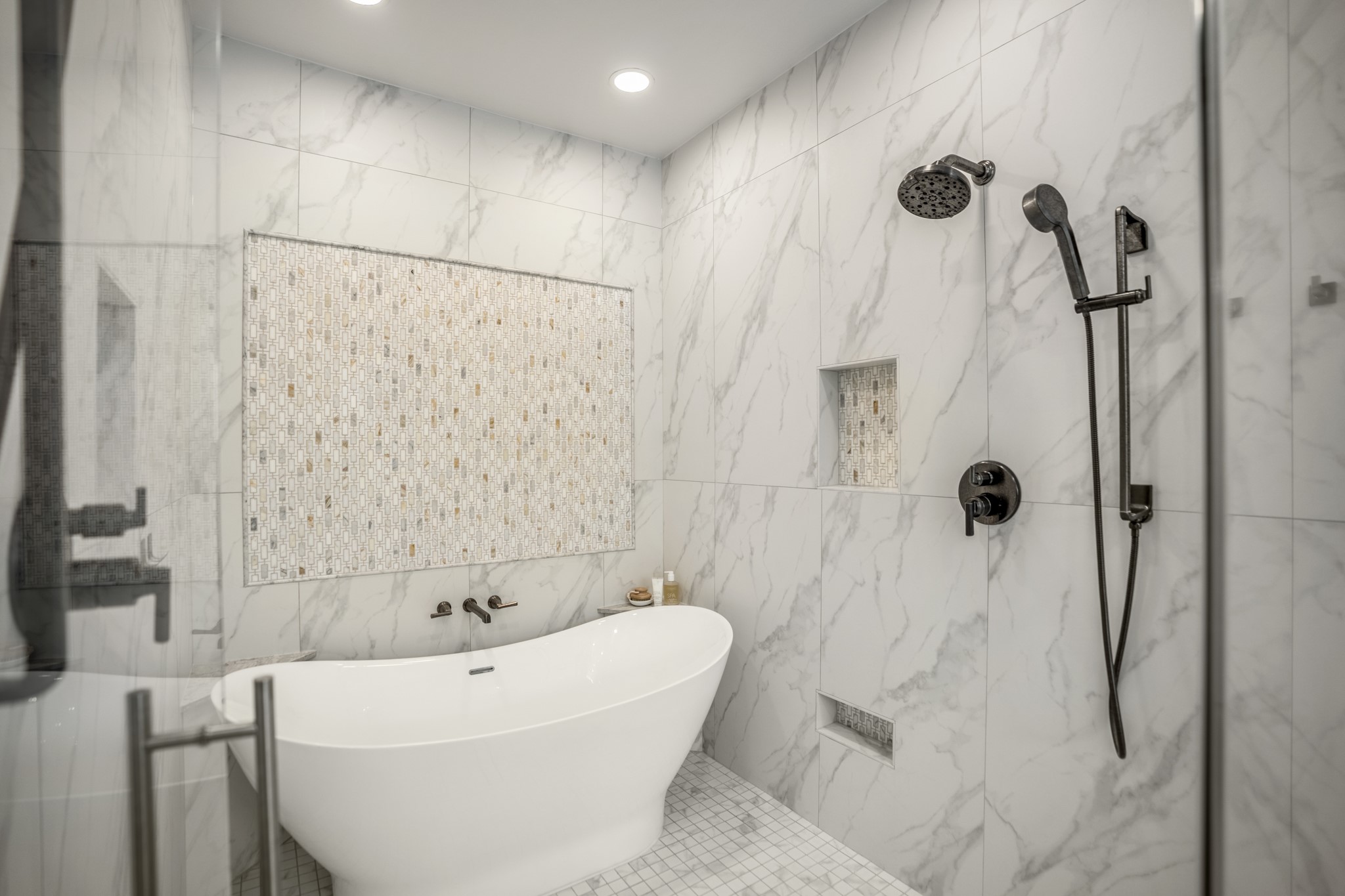9707 Blue Cruls Way Spring, TX 77379 - Photo 31 of 50 a bathroom with a white bath tub a shower and a sink