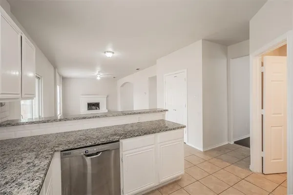 a kitchen with stainless steel appliances granite countertop a sink and a granite counter tops
