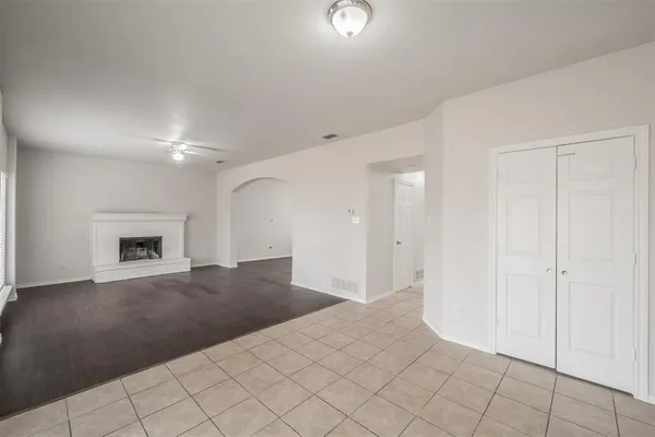 a view of an empty room with glass door
