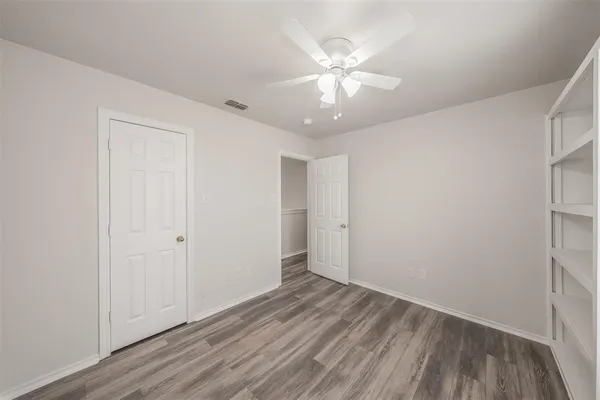 a bathroom with a granite countertop sink a toilet and bathtub