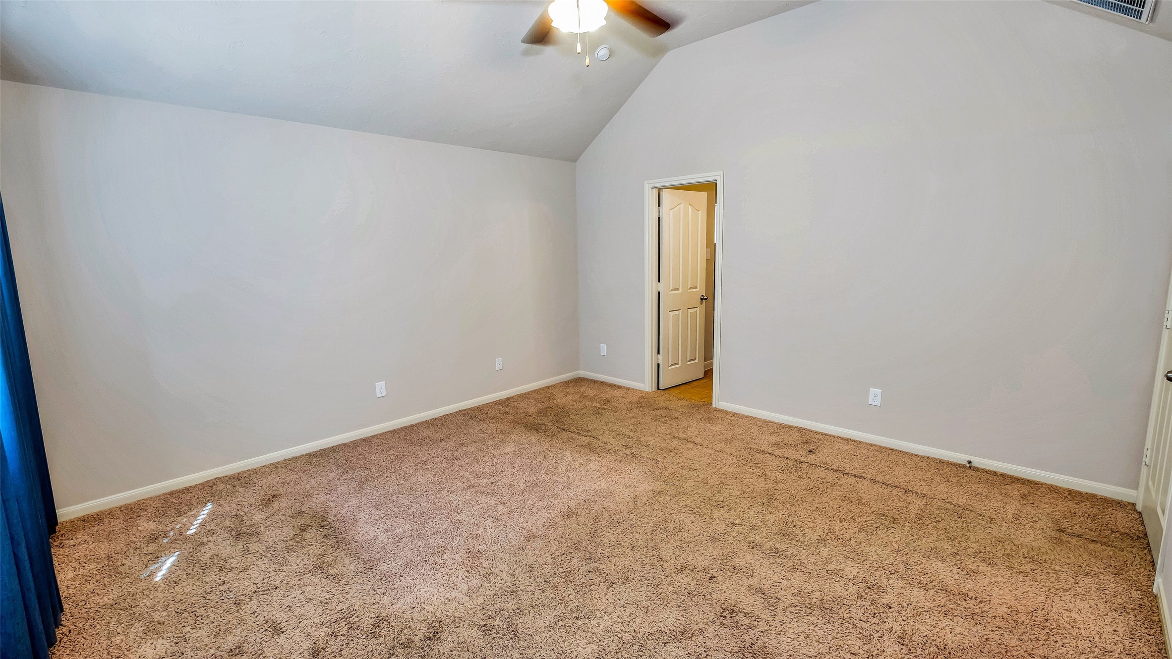 1724 Don Alejandro Houston, TX 77091 - Photo 16 of 32 an empty room with a chandelier fan and windows