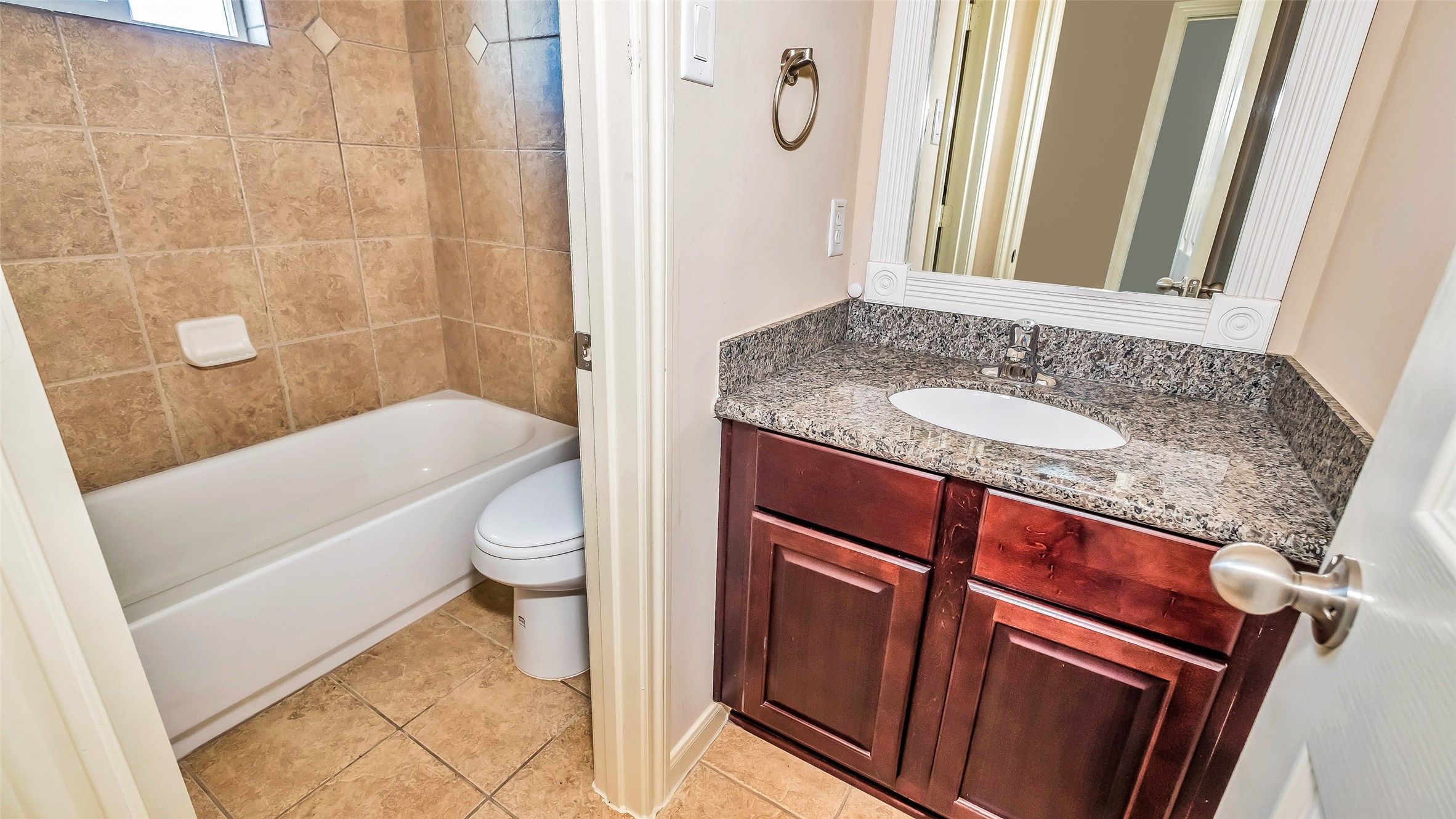 1724 Don Alejandro Houston, TX 77091 - Photo 27 of 32 a bathroom with a granite countertop sink toilet and shower