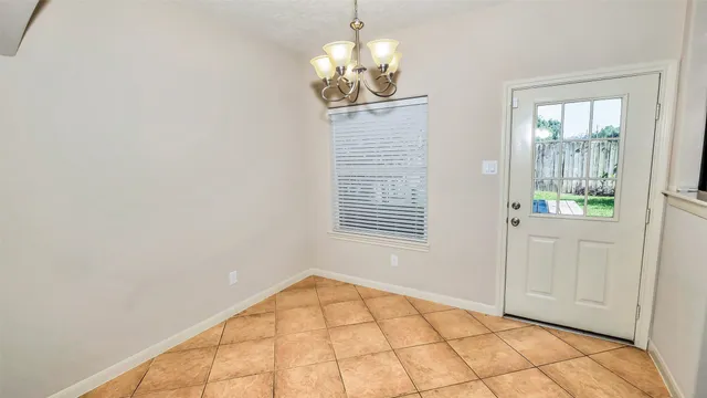 a kitchen with stainless steel appliances granite countertop a stove and a refrigerator