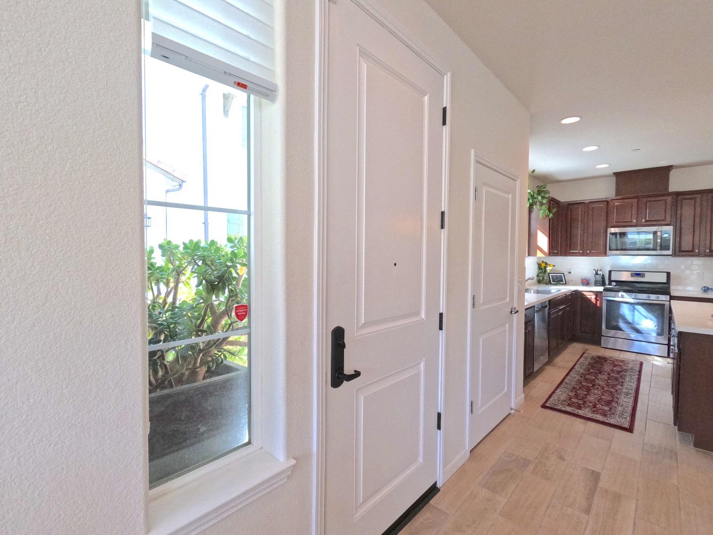 13217 Thomas Lane Marina, CA 93933 - Photo 15 of 35 a kitchen with stainless steel appliances granite countertop a refrigerator and a view of living room