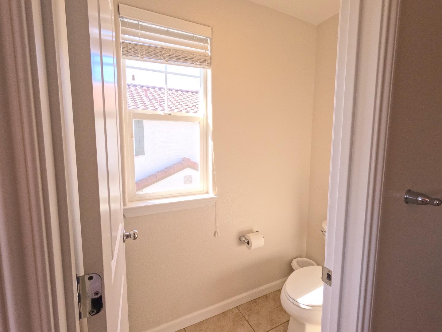 13217 Thomas Lane Marina, CA 93933 - Photo 20 of 35 a white toilet sitting next to a bathroom sink