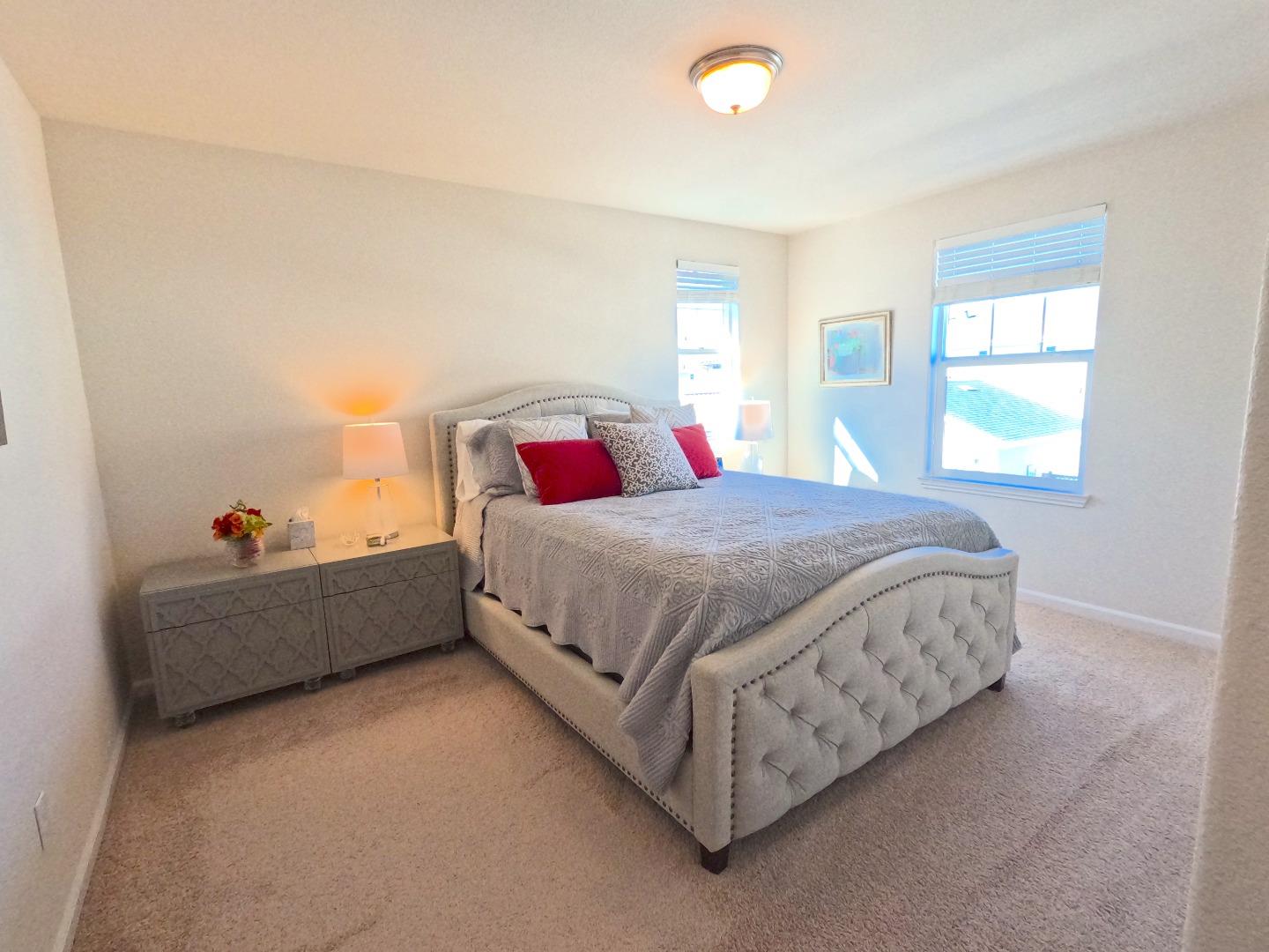 13217 Thomas Lane Marina, CA 93933 - Photo 21 of 35 a bed sitting in a bedroom next to a window