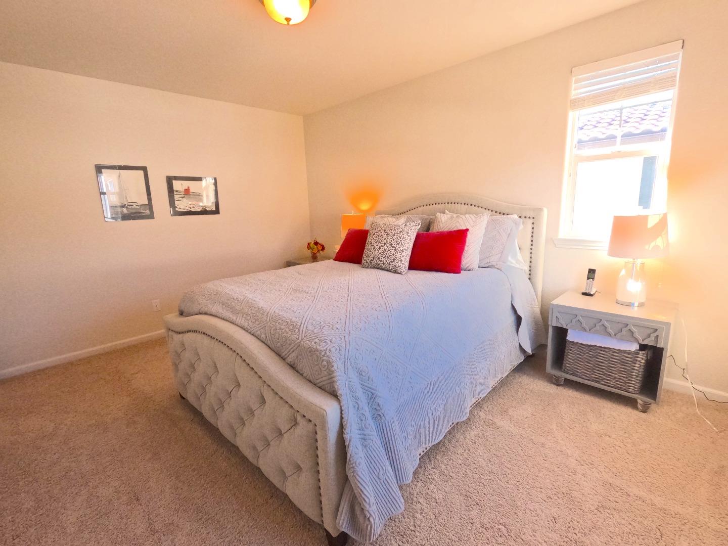 13217 Thomas Lane Marina, CA 93933 - Photo 22 of 35 a bedroom with a bed and a night stand