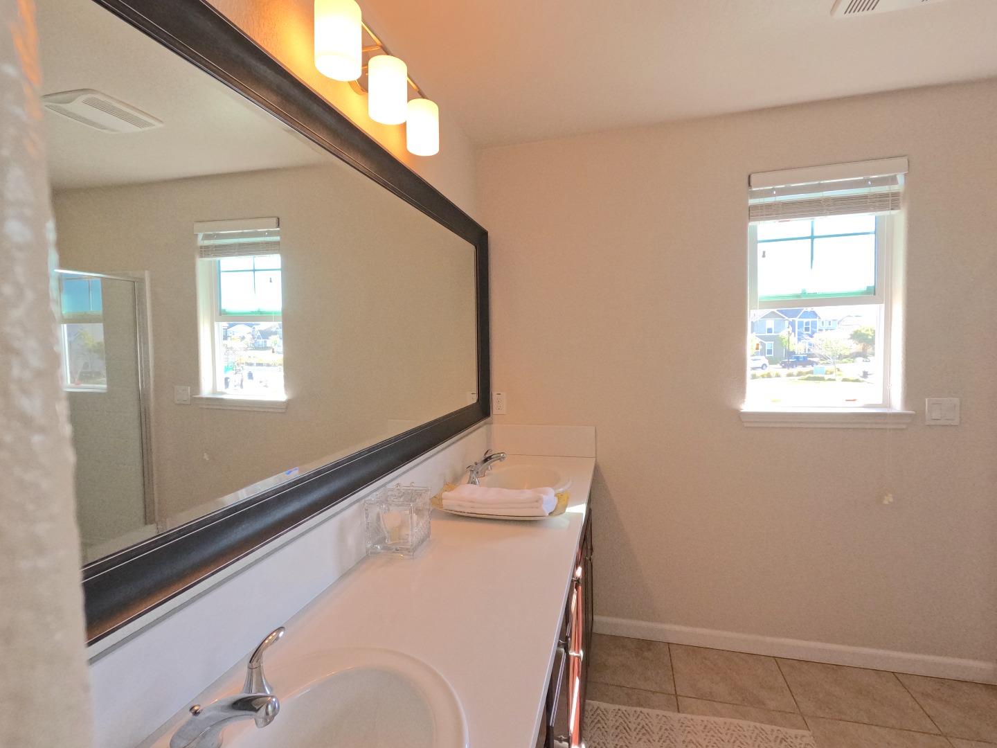 13217 Thomas Lane Marina, CA 93933 - Photo 25 of 35 a bathroom with a sink and a mirror