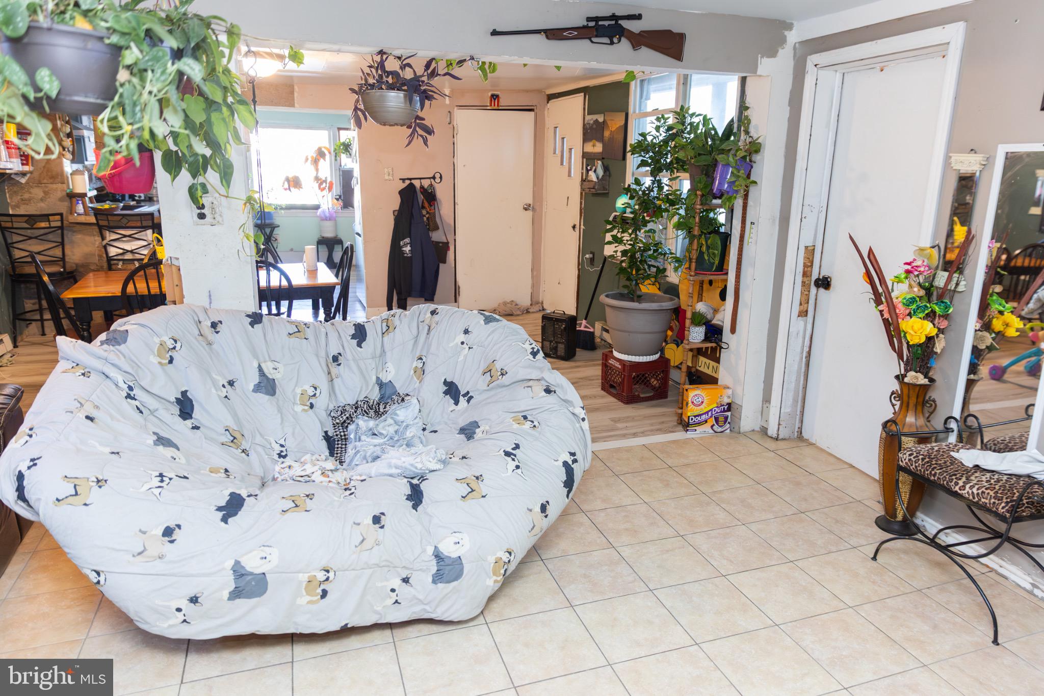 231 Laurel Street Minersville, PA 17954 - Photo 15 of 22 Spacious living area with vibrant greenery.