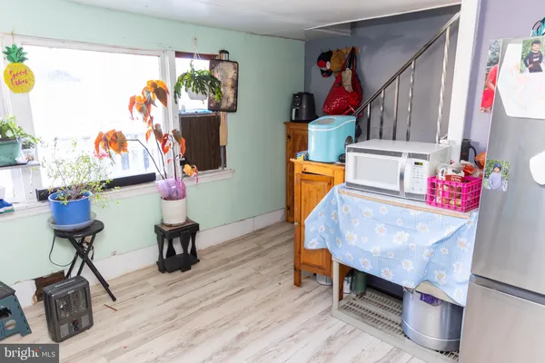 a view of entryway with wooden floor