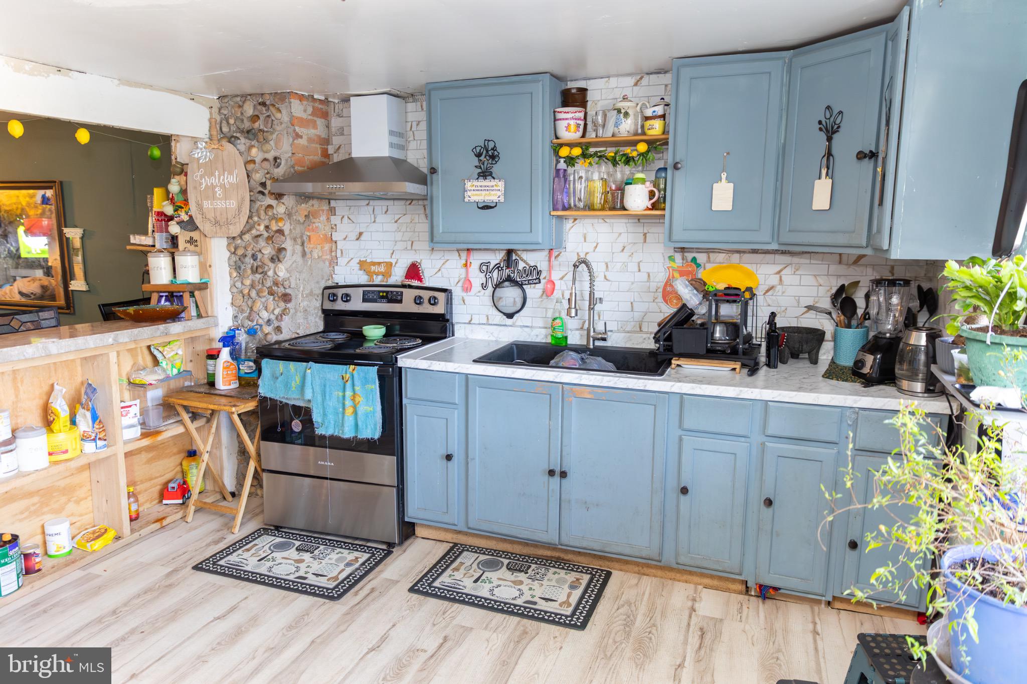 231 Laurel Street Minersville, PA 17954 - Photo 7 of 22 Charming kitchen with rustic blue cabinetry.