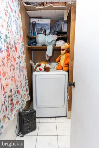 a utility room with washer and dryer