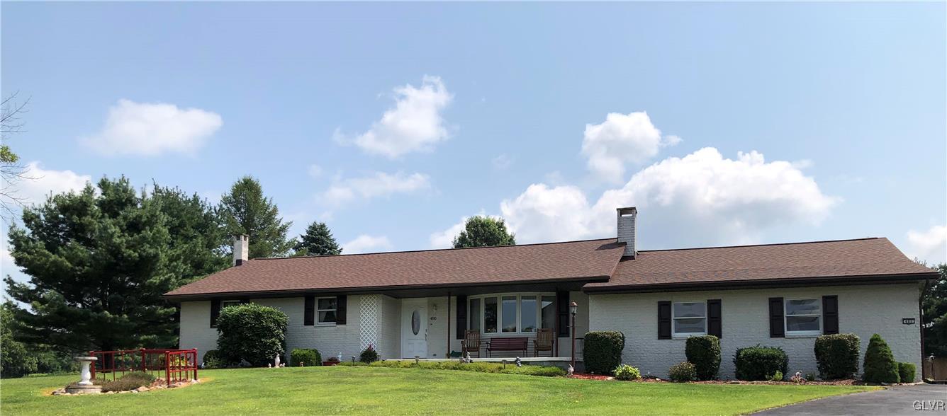 480 South Summit Road Bath, PA 18014 - Photo 1 of 31 a view of a white house with a big yard and potted plants