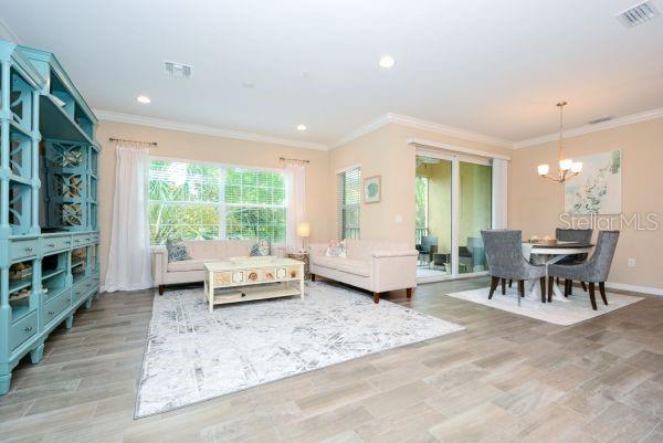 4212 Expedition Way Osprey, FL 34229 - Photo 7 of 28 a living room with furniture and a large window