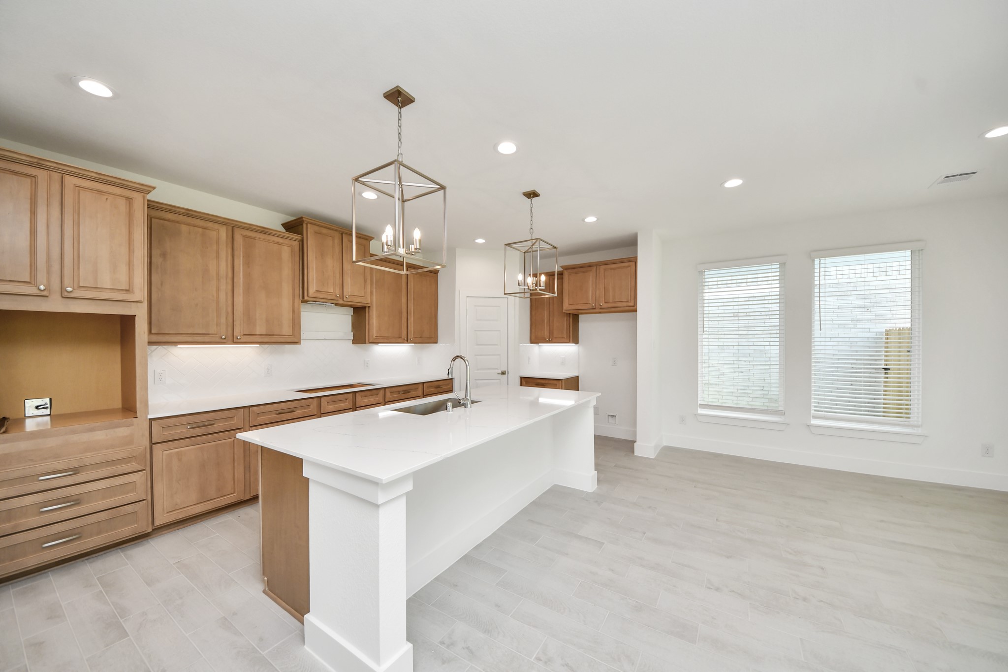 3102 Native Spg Drive Spring, TX 77373 - Photo 10 of 47 The kitchen is a culinary haven, featuring granite countertops, a tile backsplash, stainless steel appliances, 42” upper cabinets, and undercabinet lighting.