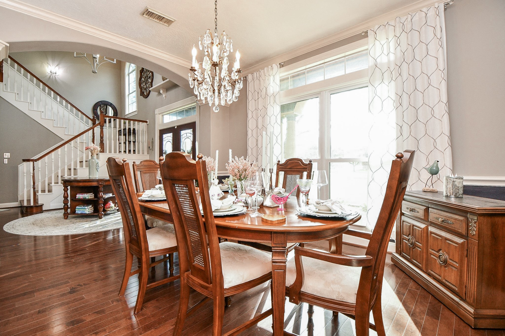 3680 Eula Morgan Road Katy, TX 77493 - Photo 13 of 50 Upscale privacy is absolutely possible in this gorgeous formal dining space, bathed in pure natural sunshine, with a warm view into the main entry foyer and divine staircase. Gleaming floors also reflect the light.