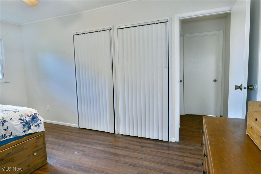 234 Howland Wilson Road Northeast Warren, OH 44484 - Photo 21 of 37 Bedroom featuring dark wood-type flooring and baseboards