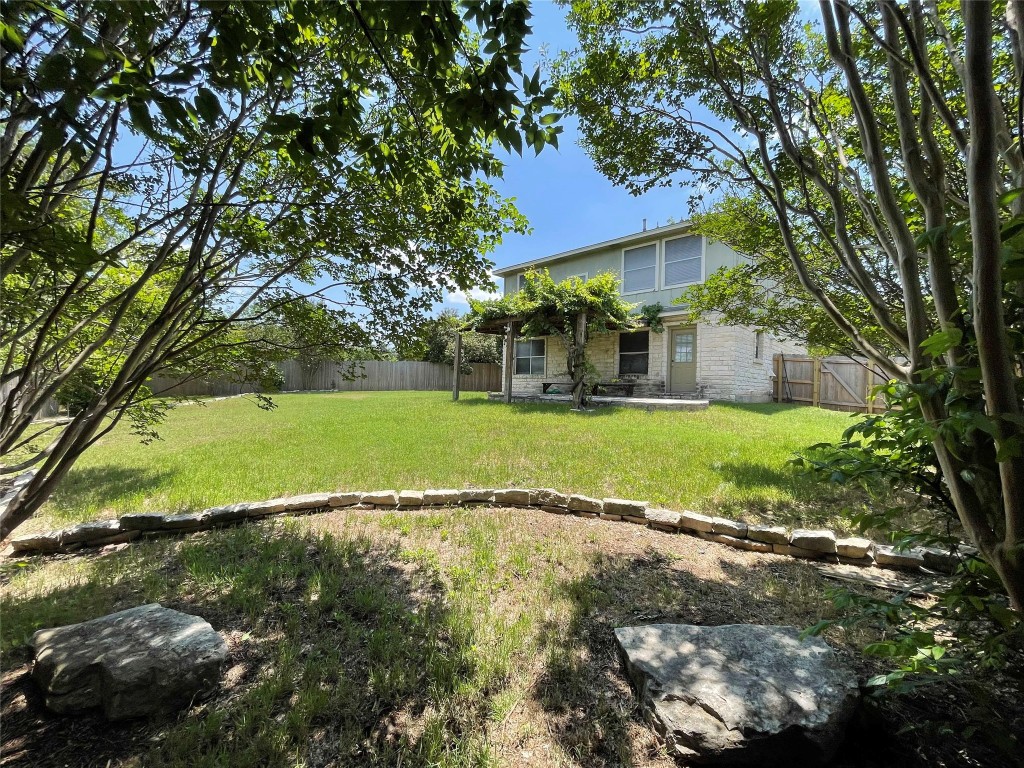 8501 Bismark Cove Austin, TX 78745 - Photo 23 of 24 a view of a house with a yard